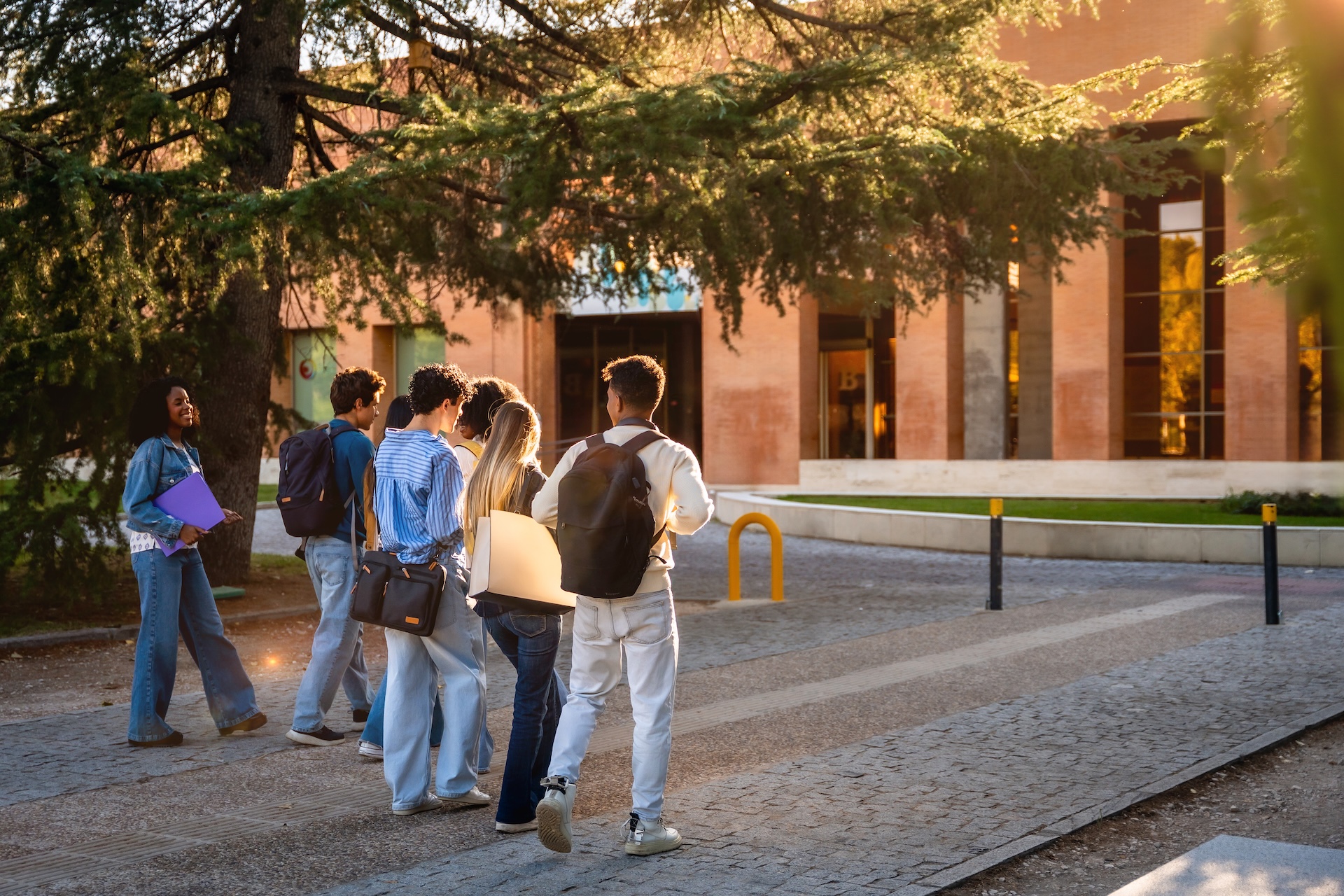 diverse-students-walking-towards-university-buildi-2026-03-25-10-03-43-utc